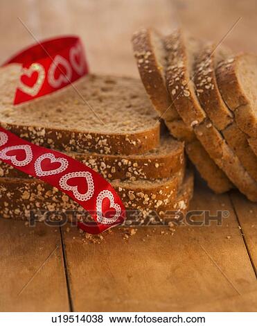 Studio Shot of bread slices with red ribbon View Large Photo Image Stock Photo - Studio Shot of bread slices with red ribbon. Fotosearch