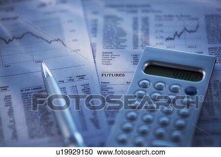 Stock Image - Studio Shot of calculator, pen and documents. Fotosearch