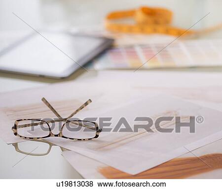Stock Photo - Studio Shot of digital tablet, sketch and spectacles. Fotosearch