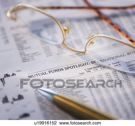 Stock Image - Studio Shot of document, pen and spectacles. Fotosearch