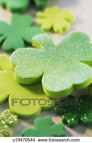Picture - Studio Shot of green foam clovers. Fotosearch