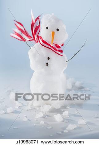 Stock Image - Studio Shot of miniature snowman. Fotosearch