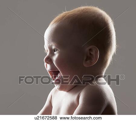 Studio shot portrait of baby boy (18-23 months) laughing View Large Photo Image Stock Photo - Studio shot portrait of baby boy (18-23 months) laughing. Fotosearch