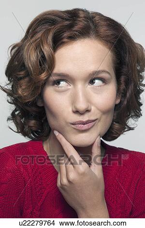 Studio shot portrait of young woman in red pullover View Large Photo Image Picture - Studio shot portrait of young woman in red pullover. Fotosearch