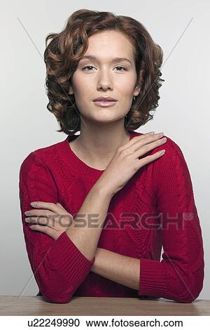 Studio shot portrait of young woman in red pullover View Large Photo Image Stock Image - Studio shot portrait of young woman in red pullover. Fotosearch