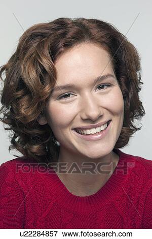 Studio shot portrait of young woman in red pullover View Large Photo Image Stock Photo - Studio shot portrait of young woman in red pullover. Fotosearch