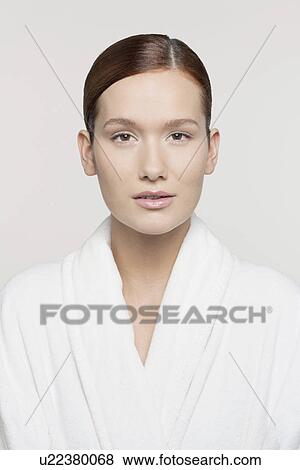 Studio shot portrait of young woman in bathrobe View Large Photo Image Stock Photo - Studio shot portrait of young woman in bathrobe. Fotosearch
