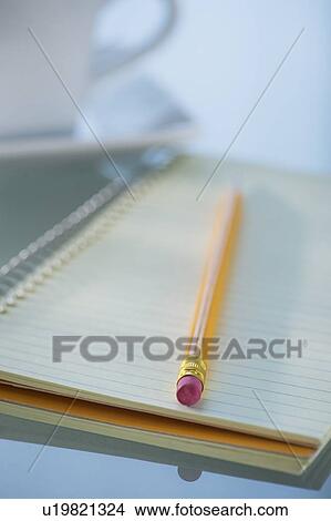 Studio Shot spiral-bound notebook and pencil View Large Photo Image Picture - Studio Shot spiral-bound notebook and pencil. Fotosearch