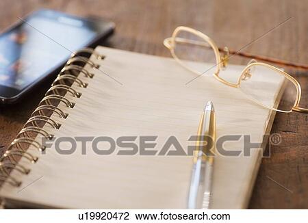 Studio Shot spiral-bound notebook and pen View Large Photo Image Stock Image - Studio Shot spiral-bound notebook and pen. Fotosearch