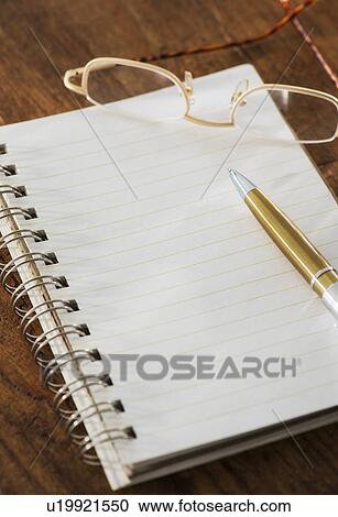 Studio Shot spiral-bound notebook and pen View Large Photo Image Stock Image - Studio Shot spiral-bound notebook and pen. Fotosearch