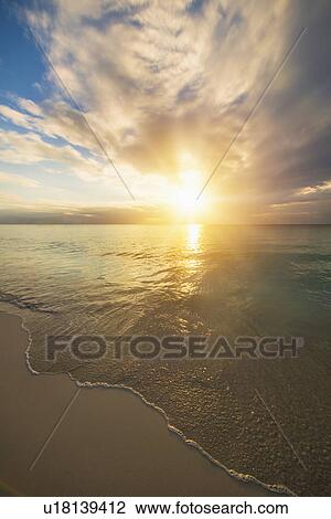 Sun setting over sea View Large Photo Image Stock Image - Sun setting over sea. Fotosearch