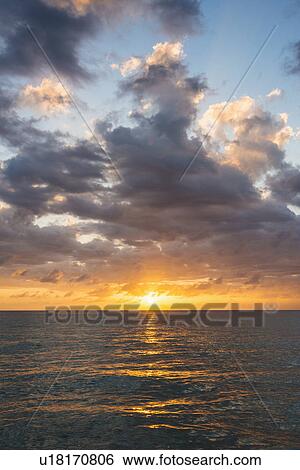 Sun setting over sea View Large Photo Image Stock Photograph - Sun setting over sea. Fotosearch