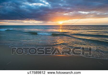 Stock Image - Sunset over sea. Fotosearch