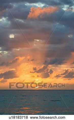 Stock Photo - Sunset over sea. Fotosearch