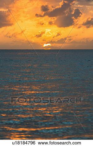 Stock Photograph - Sunset over sea. Fotosearch