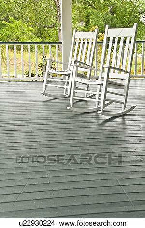Two white rocking chairs on porch View Large Photo Image Picture - Two white rocking chairs on porch. Fotosearch