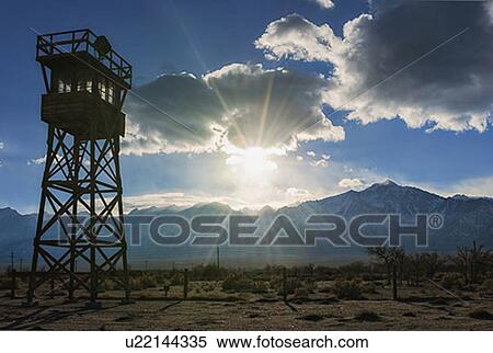 Stock Photography - View at Manzanar Historic Site with silhouette of watchtower . Fotosearch