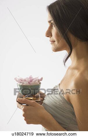 Woman holding tray with scented flower View Large Photo Image Stock Photo - Woman holding tray with scented flower. Fotosearch