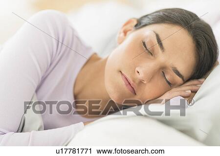 Woman sleeping in bed View Large Photo Image Stock Image - Woman sleeping in bed. Fotosearch