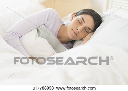 Woman sleeping in bed View Large Photo Image Stock Image - Woman sleeping in bed. Fotosearch