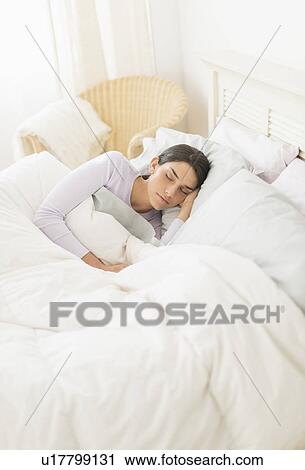 Woman sleeping in bed View Large Photo Image Stock Image - Woman sleeping in bed. Fotosearch