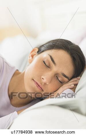 Woman sleeping in bed View Large Photo Image Stock Photo - Woman sleeping in bed. Fotosearch
