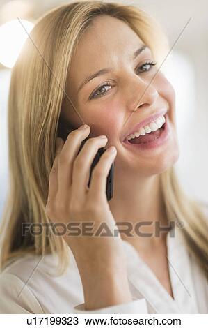 Stock Image - Woman talking on phone. Fotosearch