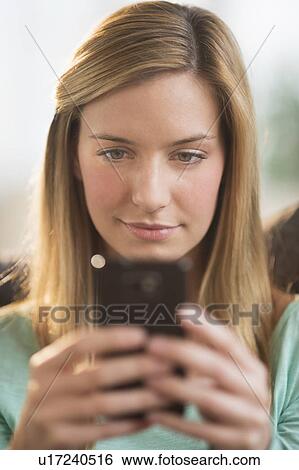 Woman using smartphone View Large Photo Image Stock Photograph - Woman using smartphone. Fotosearch