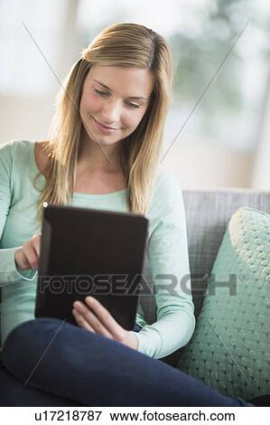 Woman using tablet pc View Large Photo Image Stock Photo - Woman using tablet pc. Fotosearch