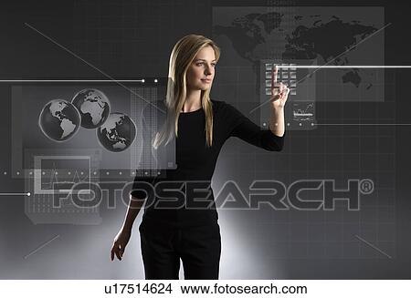 Woman using touchscreen with global data View Large Photo Image Picture - Woman using touchscreen with global data. Fotosearch