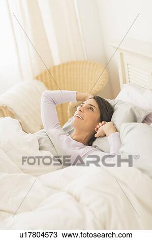 Woman waking up View Large Photo Image Stock Image - Woman waking up. Fotosearch