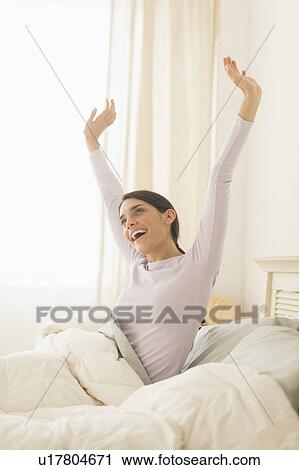 Stock Image - Woman waking up. Fotosearch