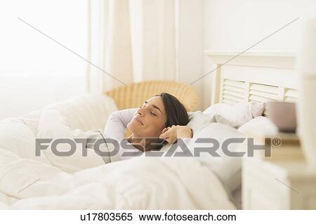 Woman waking up View Large Photo Image Stock Photography - Woman waking up. Fotosearch