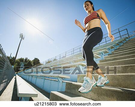 Woman walking down steps View Large Photo Image Stock Image - Woman walking down steps. Fotosearch