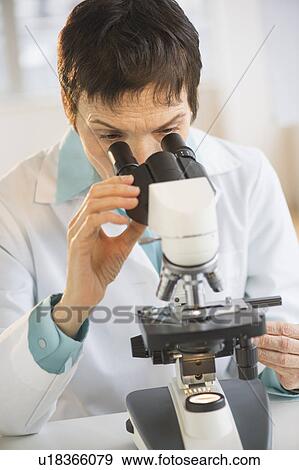 Woman working with microscope in laboratory View Large Photo Image Stock Photo - Woman working with microscope in laboratory. Fotosearch