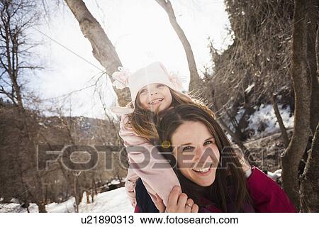 Young woman carrying her daughter (2-3) on shoulders View Large Photo Image Stock Image - Young woman carrying her daughter (2-3) on shoulders. Fotosearch