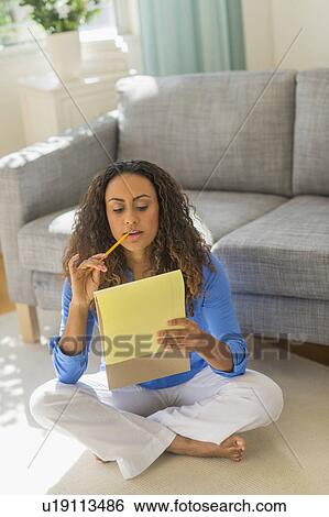 Young woman dealing with home finance View Large Photo Image Stock Photograph - Young woman dealing with home finance. Fotosearch