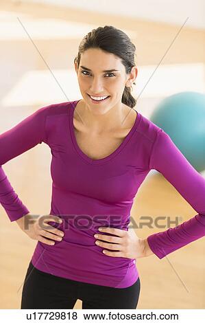 Young woman exercising View Large Photo Image Stock Photo - Young woman exercising. Fotosearch