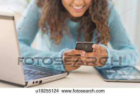 Young woman in home office View Large Photo Image Picture - Young woman in home office. Fotosearch