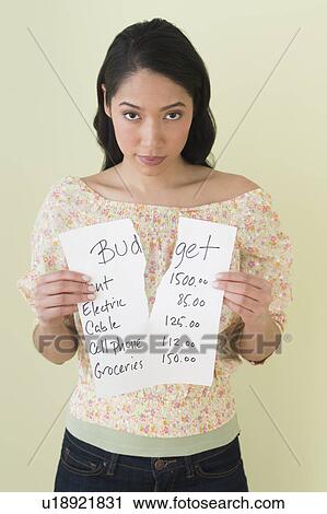 Young woman with torn list of expenses View Large Photo Image Stock Image - Young woman with torn list of expenses. Fotosearch