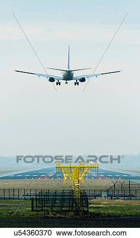 Stock Image - Aeroplane coming in to land, Amsterdam airport Shiphol. Fotosearch