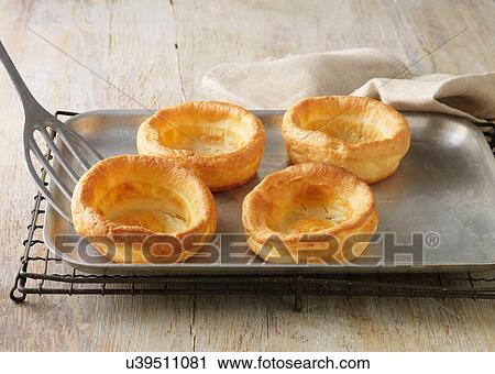 Beef dripping Yorkshire puddings on metal baking sheet View Large Photo Image Stock Image - Beef dripping Yorkshire puddings on metal baking sheet. Fotosearch