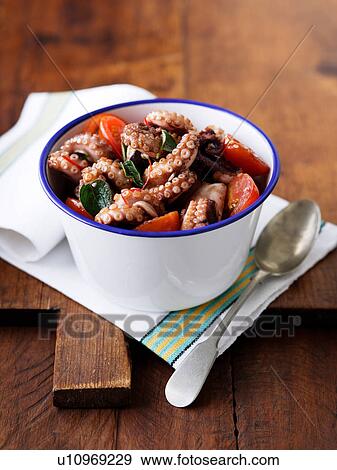 Bowl of octopus with tomatoes and chillies View Large Photo Image Stock Photo - Bowl of octopus with tomatoes and chillies. Fotosearch