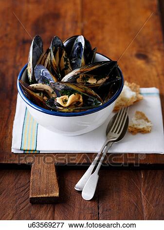 Bowl of peppered mussels View Large Photo Image Stock Photo - Bowl of peppered mussels. Fotosearch