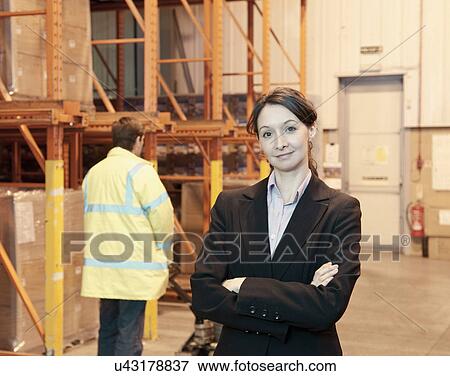 Businesswoman in warehouse View Large Photo Image Stock Photo - Businesswoman in warehouse. Fotosearch