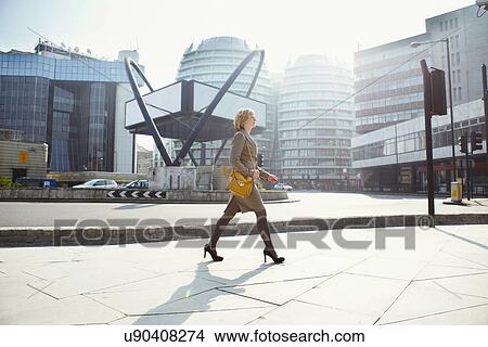 Businesswoman walking in Old Street, London, England, UK View Large Photo Image Picture - Businesswoman walking in Old Street, London, England, UK. Fotosearch