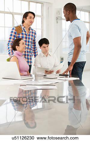 Stock Image - Casual business meeting. Fotosearch