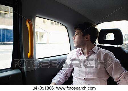 Casual businessman in black cab, London, England, UK View Large Photo Image Stock Photograph - Casual businessman in black cab, London, England, UK. Fotosearch