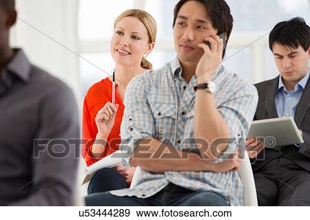 Stock Photo - Casual businessman on cell phone. Fotosearch