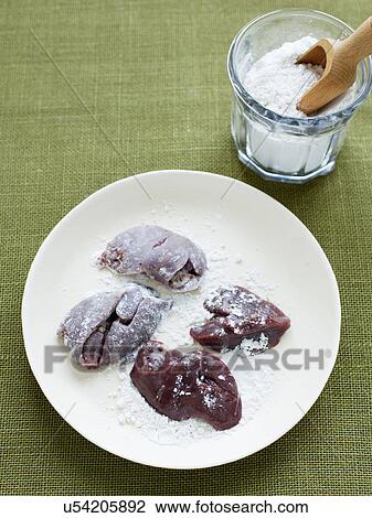 Stock Image - Chicken livers in flour. Fotosearch